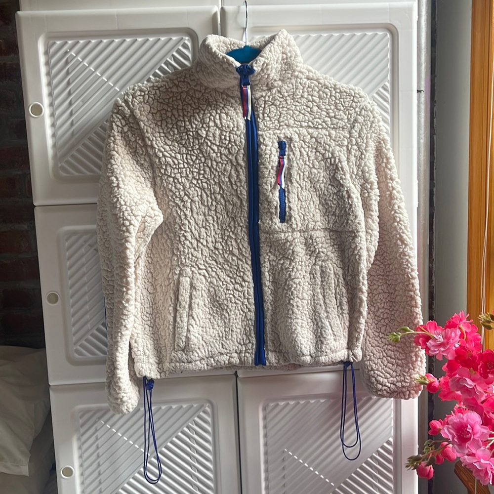 White fleece with red,blue, and white detailing from Garage